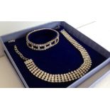 Boxed diamante necklace with matching bracelet.