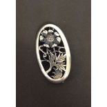 Ladies large silver brooch with London hallmark. Approx 5cm long x 3cm wide. With cut out poppy