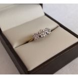 A 9ct gold & diamond trilogy ring. Total diamond carat weight approx 0.50ct - 0.60ct, size H.