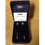 A pair of boxed Ortak Scottish thistle stick pins - white metal possibly silver.
