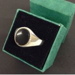 Gents silver ring set with black onyx, Size X.