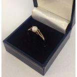 Ladies hallmarked 9ct gold dress ring set with a cultured pearl. Size approx U 1/2.