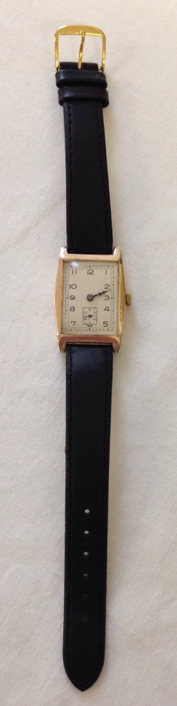 Hallmarked 9ct gold watch in good working order. Swiss made, retangular Art Deco design. 15 jewels