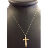 Hallmarked 9ct gold cross pendant on 18" 375 chain. Total weight approx 2.1g