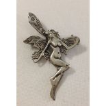 A 925 silver naked fairy design brooch approx 5cm long.