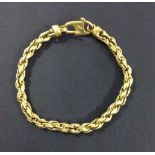 A heavy 24ct gold rope bracelet. Approx 31.2g 7.5 inches long. Marked 24k and tests as 24k