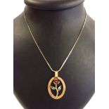 An enamelled 18ct gold rose pendant on an 18" 14ct gold chain. Weights approx: pendant 6.7g &