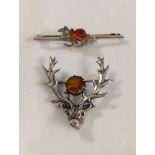 1939 Hallmarked silver stags head brooch approx 3cm x 3.5cm with central amber coloured stone,