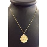 9ct gold astrological design pendant set with small white stone on 24" twisted gold chain. Total