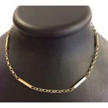 18" decorative 9ct gold chain with engraved oblong blocks. Weight approx 10.8g