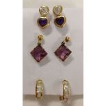 3 pairs of gold earrings set with amethysts & crystals. All pairs test as 9ct gold.