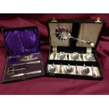 An EPNS boxed set of fruit spoons with a part boxed manicure set.