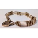 A 9ct rose gold 5 bar gate bracelet with heart padlock approx 22.5g.