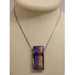 Art glass multi-coloured shimmering pendant on a 16" silver chain.