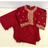 A vintage ladies 3 piece Indian Sari in red with gold embroidery.