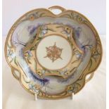 A Nippon 3 handled dish decorated with handpainted landscape and yellow and blue flowers. Central