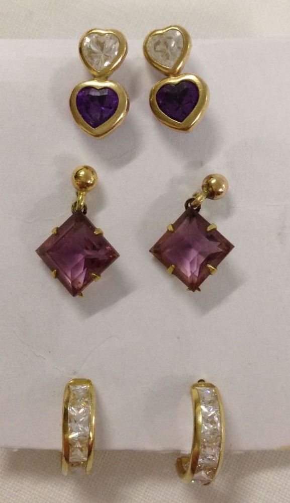 3 pairs of gold earrings set with amethysts & crystals. All pairs test as 9ct gold.