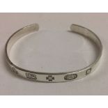 Silver Millennium hallmark bangle by London designer silversmiths A. Haviland-Nye