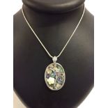 Abalone pendant with flower design on a white metal chain stamped 925.