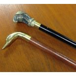 2 walking sticks with internal flasks - 1) brass duck head and 2) eagle.