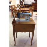 A vintage Brother sewing machine & table