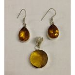 Round citrine quartz pendant set in 925 silver with matching pear shaped drop earrings.