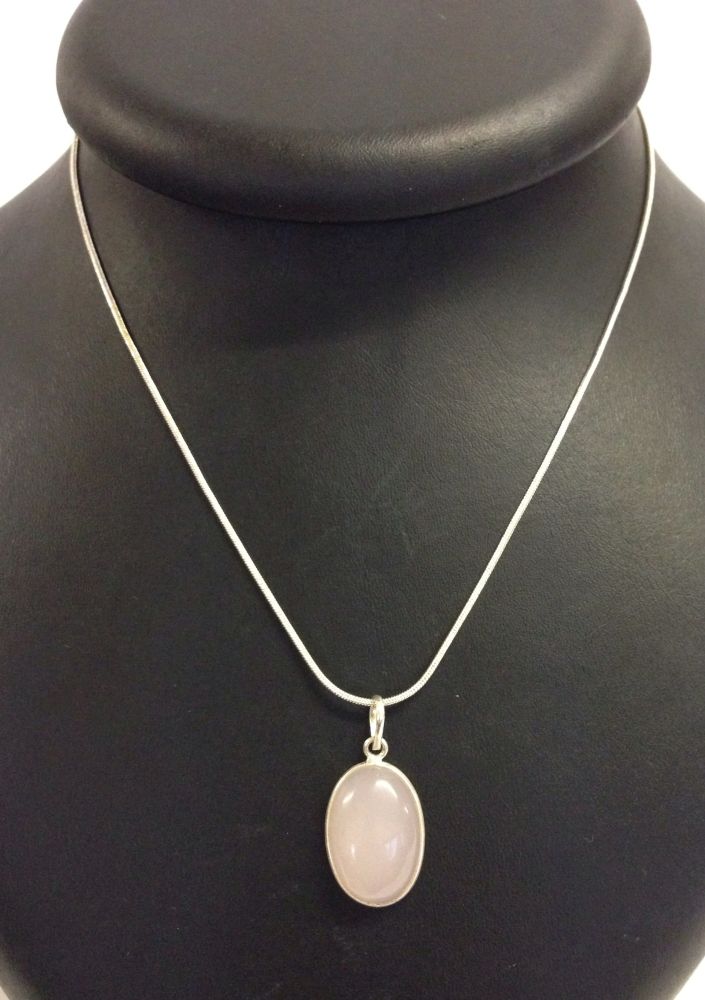 Rose quartz oval shaped pendant set in silver on a white metal chain marked 925.