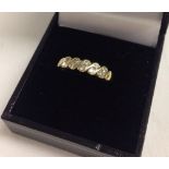 9ct gold ring set with 10 small diamonds in 5 diagonal blocks of 2.  Size M, total weight approx 1.