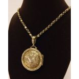 A 9ct gold circular locket & chain. Approx 12.8g.