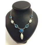 Necklace set with labradorite and created blue quartz in white metal.