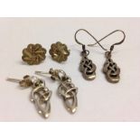 3 pairs of silver earrings, 2 pairs with celtic design drops and flower design studs.