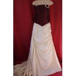 New and unused silk wedding gown by Christine Elizabeth. In burgundy and cream with burgundy