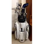 A set of golf clubs to include Dunlop DM3, Ping, & Callaway clubs in a white Powerkaddy bag