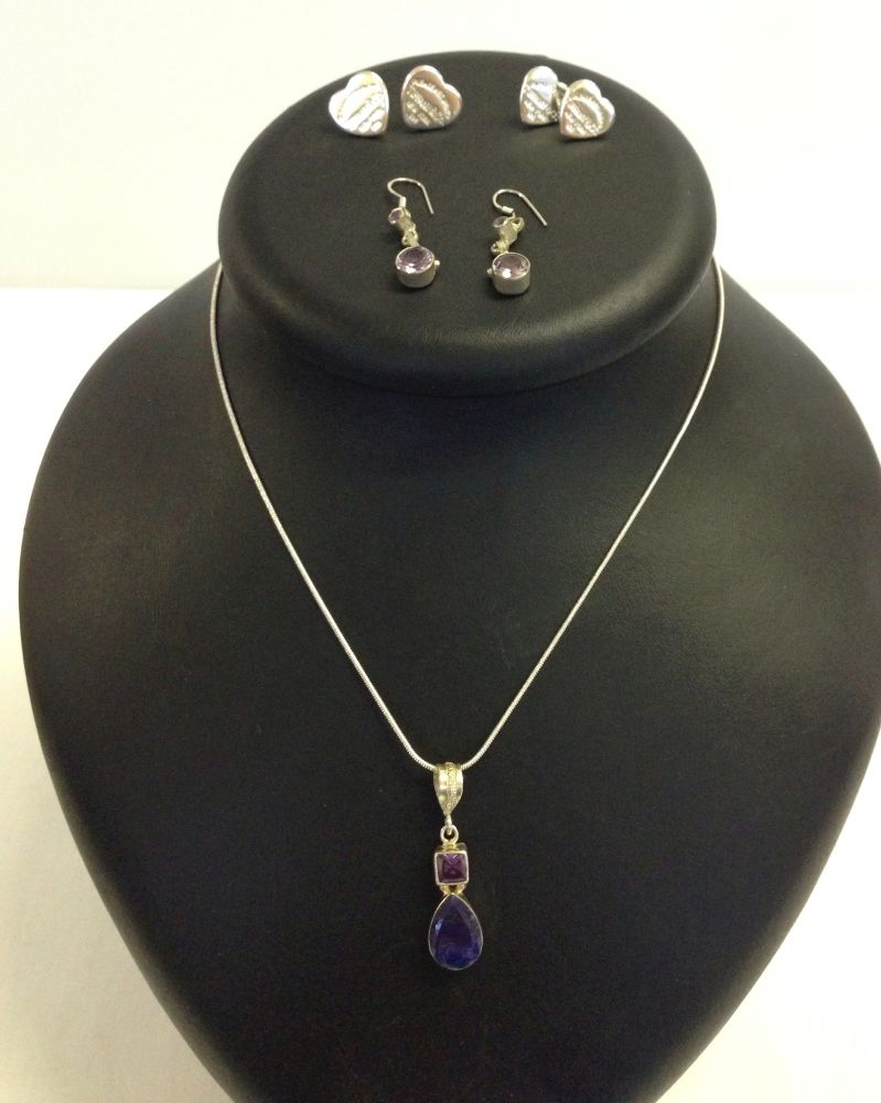 A silver necklace with amethyst pendant together a pair of drop earrings set with amethyst and 2