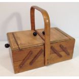 A vintage sewing box with handle.
