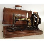 A vintage cased Singer sewing machine.