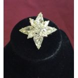 A signed Weiss Star shaped brooch set with clear stones 1947-1955.