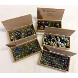 5 boxes of vintage marbles in various sizes.