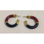 Gold plated 925 silver hoop earrings with red and green design.