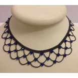 Costume jewellery evening necklace, collar design set with 31 electric blue stones.