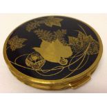 A vintage 'Mascot' ASB ladies compact with black enamel & leaf decoration.