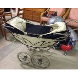 A vintage Royale twin dolls pram c1950s complete with original bag. Good condition, some wear to