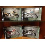 4 boxed New Ray Road Ride motorcycles.