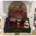 A boxed Avon Musical Ferris Wheel Christmas decoration.