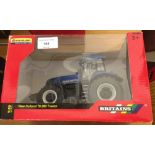 A boxed Britains 1:32 scale New Holland T8.390 tractor #42726.