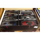 A trade box of 12 1:32 scale diecast sports cars.