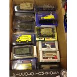 A collection of 18 boxed models from various makers to include tanks and Michelin vans.