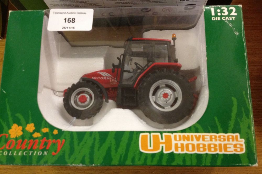 A boxed Universal Hobbies 1:32 scale McCormick CX105 tractor #2389.