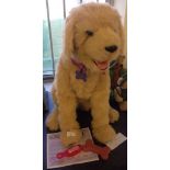 A large Fur Real Friends Biscuit Interactive Dog. On voice commands he sits, lies down, barks,