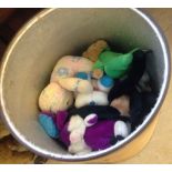 A large tub of assorted soft toys.